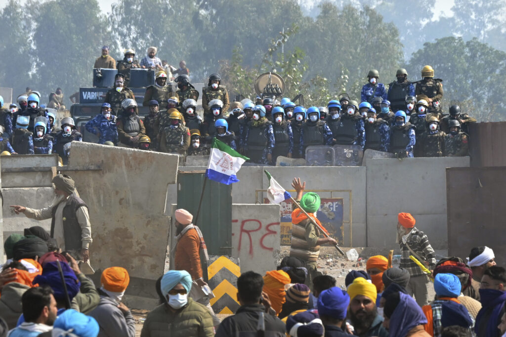NEW DELHI — ‘We actually produce something,’ say the farmers: Protesting farmers face armed police personnel near the Shambhu border that divides northern Punjab and Haryana states, almost 200 km (125 miles) from New Delhi, India, Wednesday, Feb.14, 2024. Protesting Indian farmers Wednesday clashed with police for a second consecutive day as tens of thousands of them tried to march to the capital, New Delhi, to demand guaranteed crop prices for their produce.Photo: Rajesh Sachar/AP