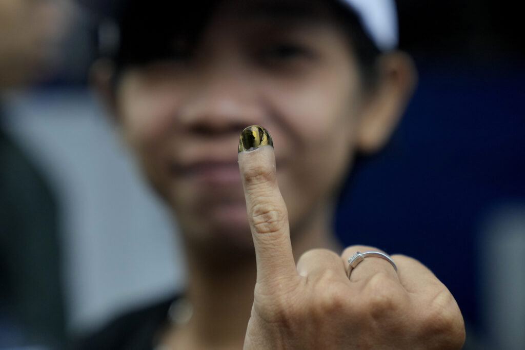 JAKARTA — Giving democracy the finger — in a positive way: A woman shows her finger inked to mark that she has already voted during the election in Jakarta, Indonesia, Wednesday, Feb. 14, 2024. Millions of Indonesians were choosing a new president Wednesday as the world's third-largest democracy aspires to become a global economic powerhouse just over 25 years since emerging from a brutal authoritarian era.Photo: Dita Alangkara/AP