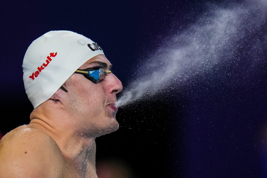 QATAR — At one with the water: Arkadios Aspougalis of Greece sprays water as he prepares to compete in the mixed 4x100m medley heat at the World Aquatics Championships in Doha, Qatar, Wednesday, Feb. 14, 2024.Photo: Hassan Ammar/AP