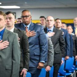 New court officer recruits stand with hands over hearts, pledging allegiance to mark the beginning of their rigorous training journey at the Court Officer Academy.Photos courtesy of the NYS Unified Court System