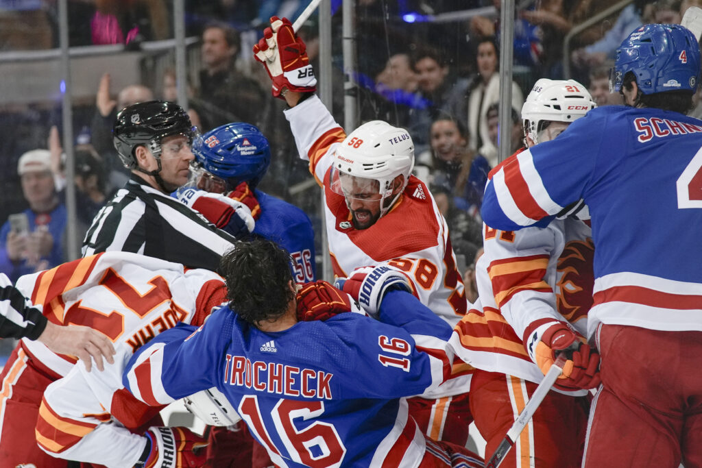 NEW YORK — Brawling, though a traditional part of the game, can still land you in the penalty box: Players fight during the second period of an NHL hockey game between the New York Rangers and the Calgary Flames on Monday, Feb. 12, 2024, in New York.Photo: Bryan Woolston/AP