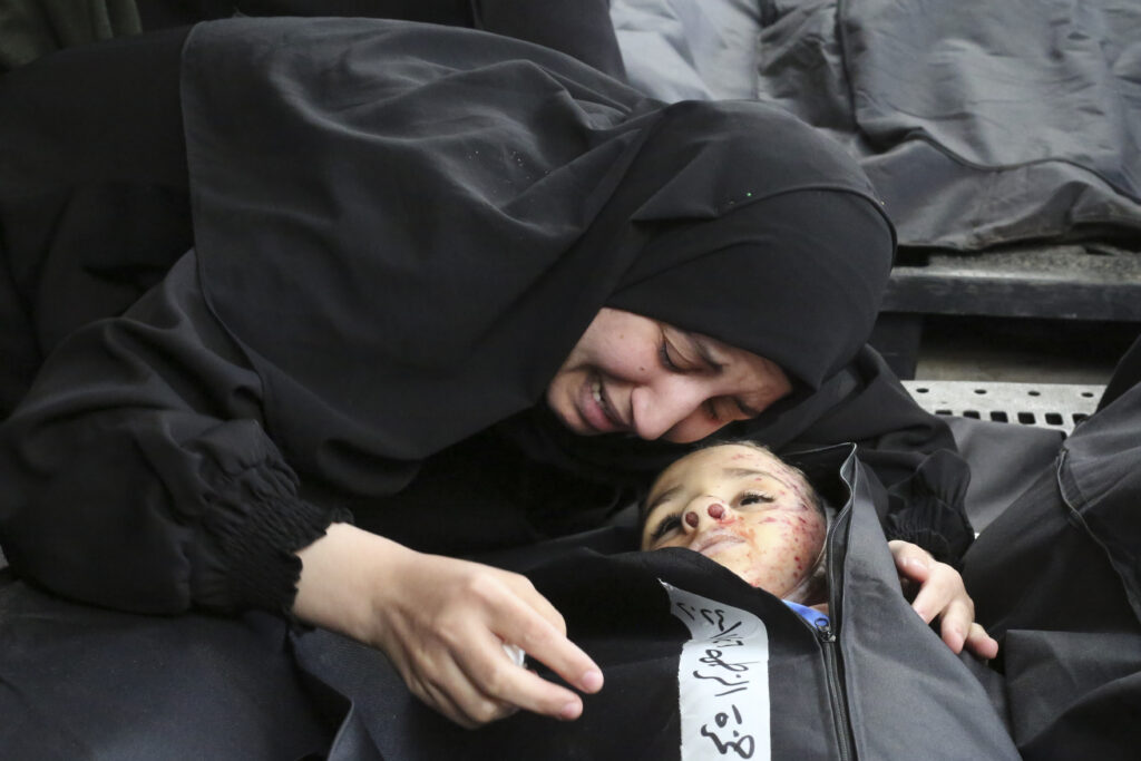 GAZA — The relentless horrors of a war-torn region: A Palestinian woman mourns a child killed in the Israeli bombardment of the Gaza Strip at a morgue in Khan Younis, Tuesday, Feb. 27, 2024.Photo: Hatem Ali/AP