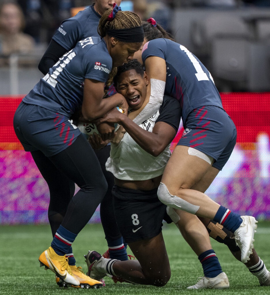 VANCOUVER — For some, rugby is just one big hug: Fiji's Ana Maria Naimasi, center, is squeezed by United States's Ariana Ramsey, left, and Alex Sedrick, right, during a Vancouver Sevens rugby game, Sunday, Feb. 25, 2024, in Vancouver, British Columbia.Photo: Ethan Cairns/The Canadian Press via AP