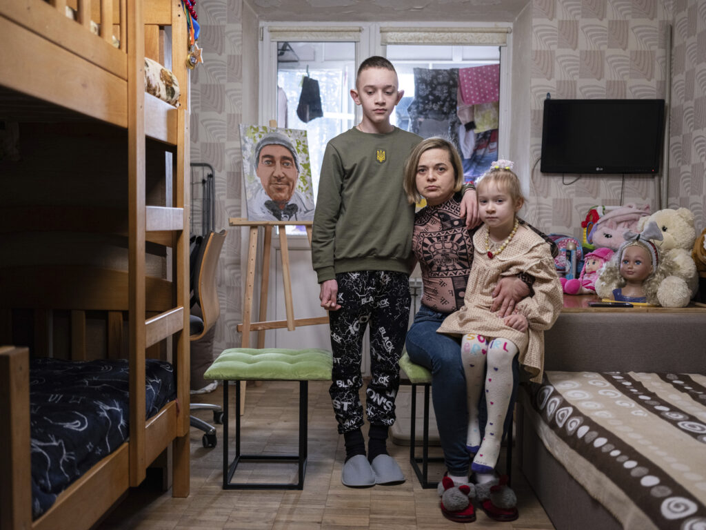 KYIV — The lives of families when ordinary men become soldiers: Natalia Sheleshei, 39, with her children Yehor, 12, and Anastasia, 5, wait for the return of Serhii at their apartment in Kyiv, Ukraine, on Feb. 12, 2024. Serhii Sheleshei, 49, a Ukrainian serviceman, went missing with three of his comrades during fighting at the frontline near Zaitseve, Donetsk region, on Oct. 12, 2022. "For a year and five months, I've lived with the uncertainty of whether my husband is alive or not," Natalia, who juggles two jobs, says. "He adored the children. Whenever he could, he would call, saying 'I love you' and 'I worry about you,'" Natalia recounts the time when Serhii was at the frontline.Photo: Evgeniy Maloletka/AP