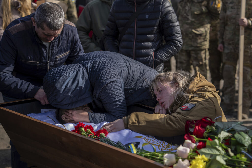 PAVLOHRAD — The continuing civilian pain in Ukraine: Elena Kuzmenko cries over the body of her son Yehor Voloshyn, 27, also known by the call sign "Kobzar" during the funeral ceremony in Pavlohrad, Dnipropetrovsk region, Ukraine, Monday, Feb. 26, 2024. Sergeant Voloshyn of the 3rd Assault Brigade was killed in the fighting near Avdiivka on Feb.21, 2024.Photo: Alex Babenko/AP