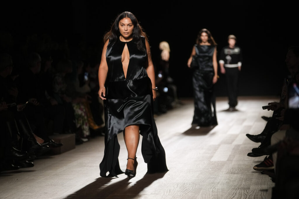 MILAN — An Italian runway with plus-size and draperies: Paloma Elsesser wears a creation as part of the Ferragamo women's Fall-Winter 2024-25 collection presented in Milan, Italy, on Saturday, Feb. 24, 2024.Photo: Luca Bruno/AP