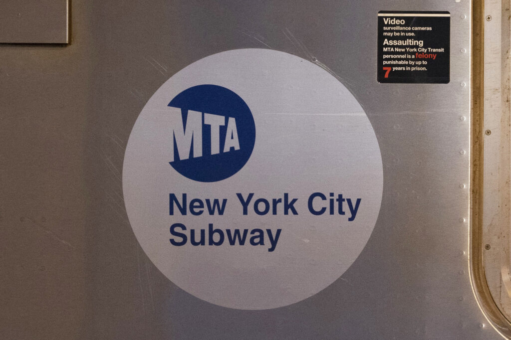 The MTA logo is seen on the side of a New York City subway car.