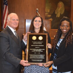 The Catholic Lawyers Guild honored Margherita Racanelli, a court attorney referee in Surrogate’s Court as part of its Shrove Tuesday celebration. Racanelli (center) was presented with a plaque by Gregory Cerchione and Hon. Betsey Jean-Jacques, president of the Guild.Photos: Robert Abruzzese/Brooklyn Eagle