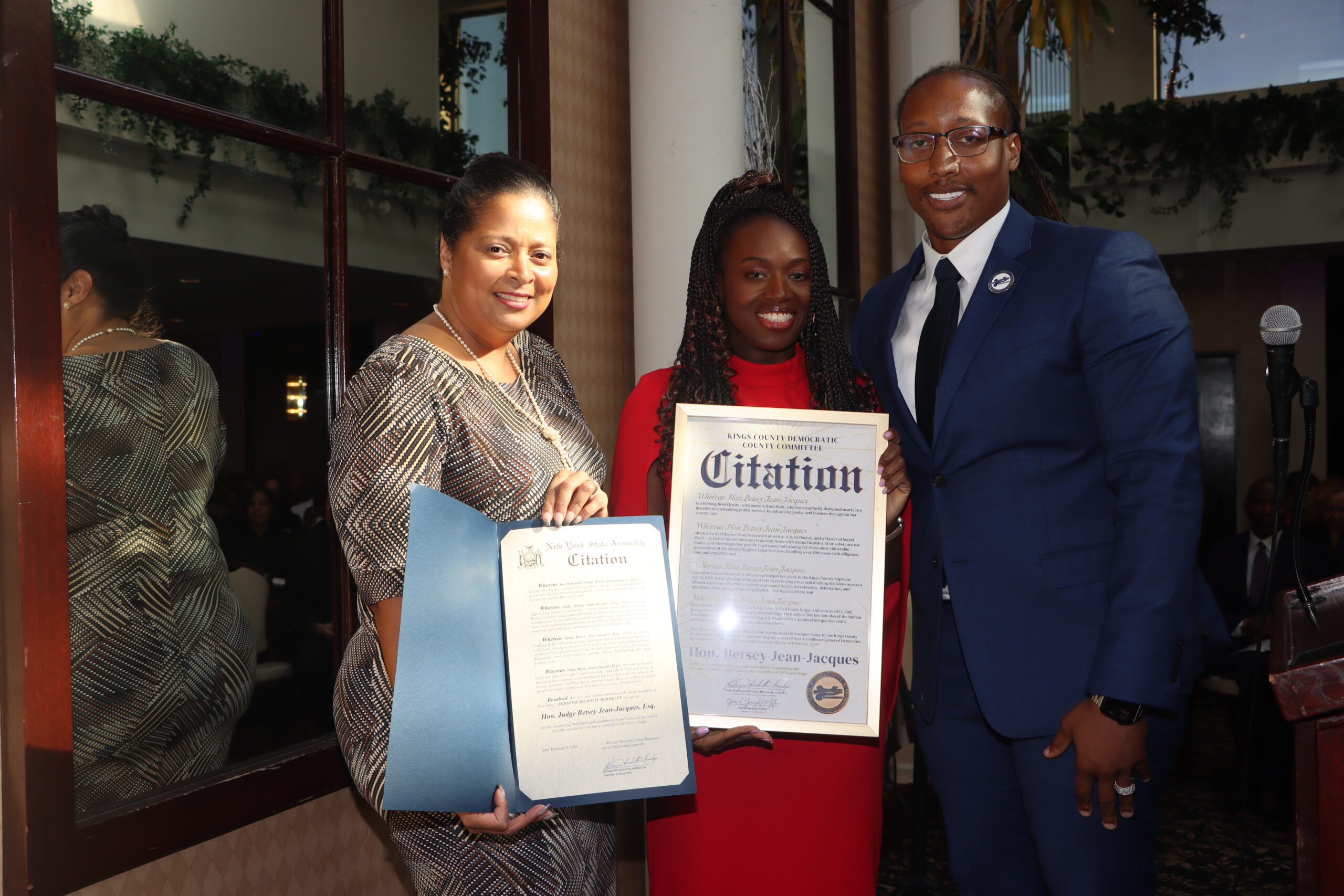 Arleny Alvarado-McCalla and Yamil Speight-Miller honor Judge Jean-Jacques with citations, celebrating her achievements and contributions to the community.