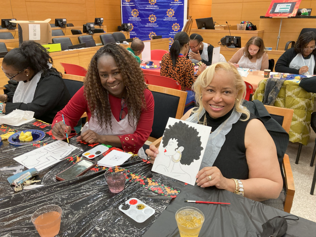 Leah Richardson (left) and Hon. Deborah Dowling, co-chairs of the Kings County Courts’ Black History Month Committee, taking part in the Tribune Society’s “Chat and Paint” event on Tuesday.Photos: Robert Abruzzese/Brooklyn Eagle