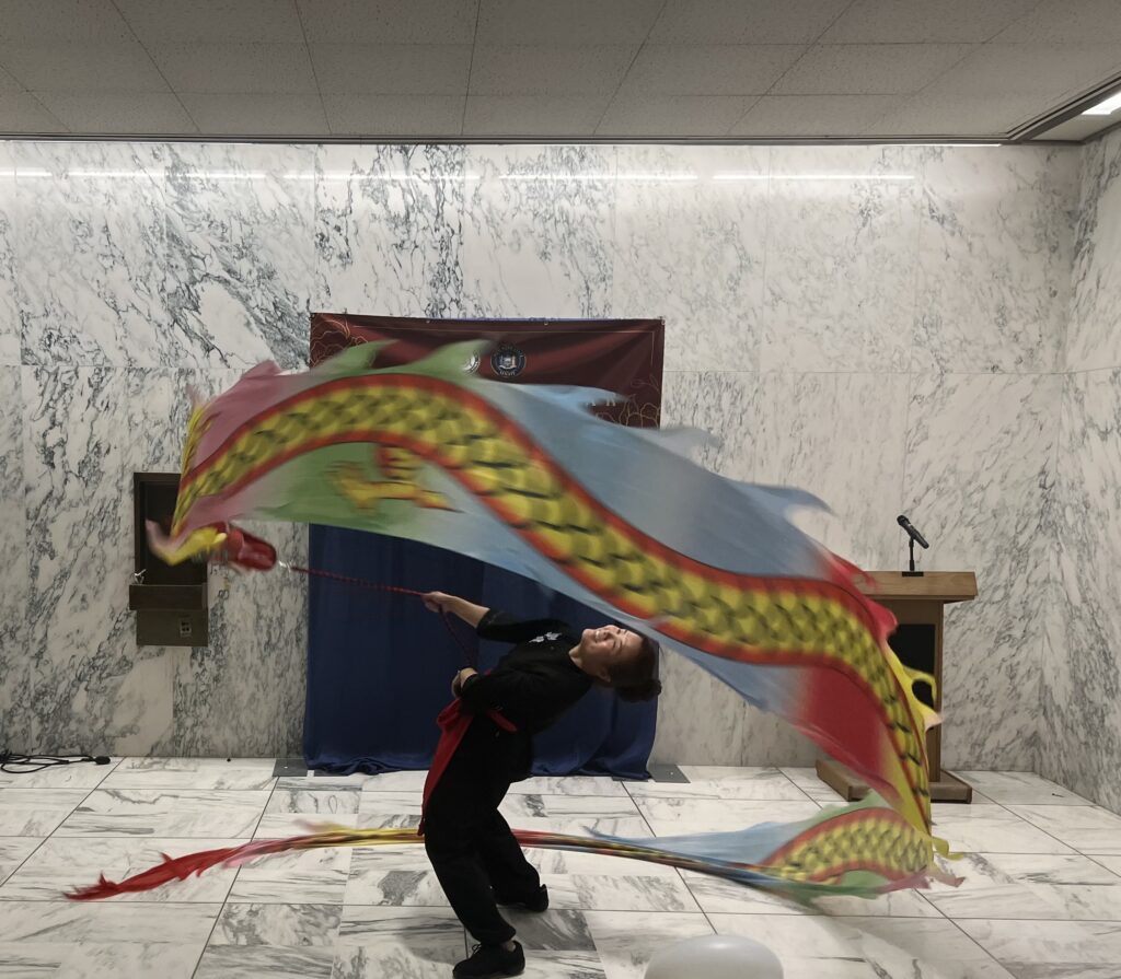 A member of the Chinese Community Center of Albany performing at Chinese New Year celebration.