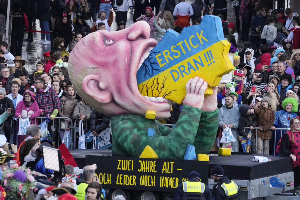 DUESSELDORF — Carnivals are for celebration, fun, and making fun: A carnival float depicts Russia's president Vladimir Putin eating Ukraine, lettering reads "choke on it" during the traditional carnival parade in Duesseldorf, Germany, on Monday, Feb. 12, 2024. The foolish street spectacles in the carnival centers of Duesseldorf, Mainz and Cologne, watched by hundreds of thousands of people, are highlights in Germany's carnival season on Rosemonday.Photo: Martin Meissner/AP