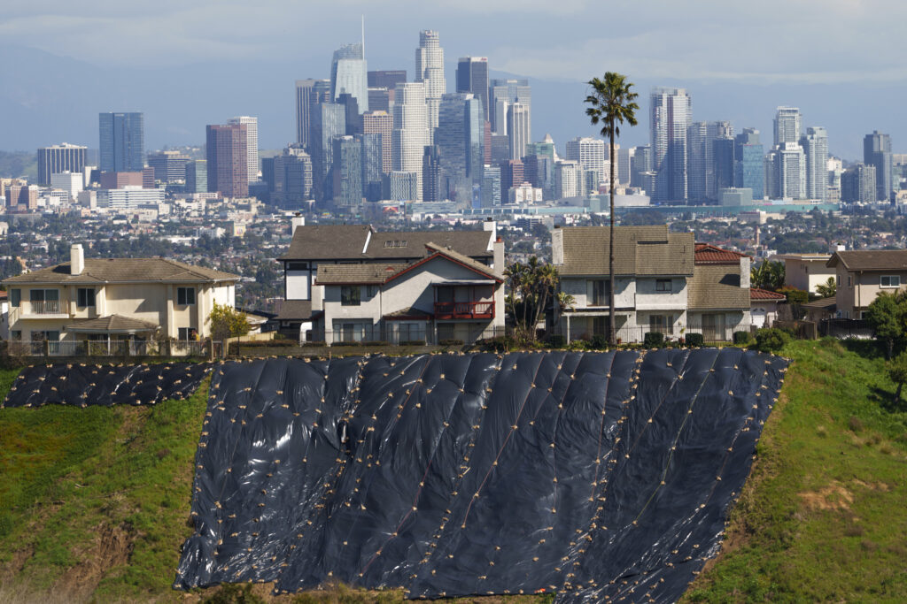 LOS ANGELES — Mudslide prevention in the City of Angels: The Los Angeles skyline is seen from the Kenneth Hahn State recreation area in Los Angeles, Wednesday, Feb. 21, 2024. Much of saturated California remains under threat of floods as the latest winter storm blows through, but so far, the state has escaped the severity of damage spawned by a recent atmospheric river.Photo: Damian Dovarganes/AP