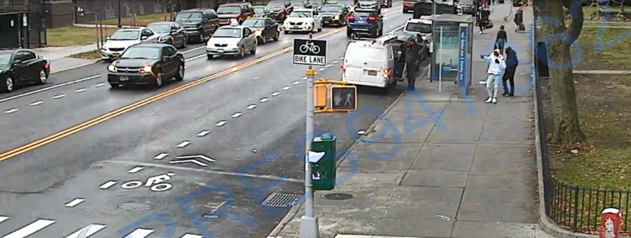A surveillance still captures the moment of a daylight shooting in East New York, where defendant Tyquan Robinson can allegedly be seen firing across traffic.Photo courtesy of U.S. Justice Dept.
