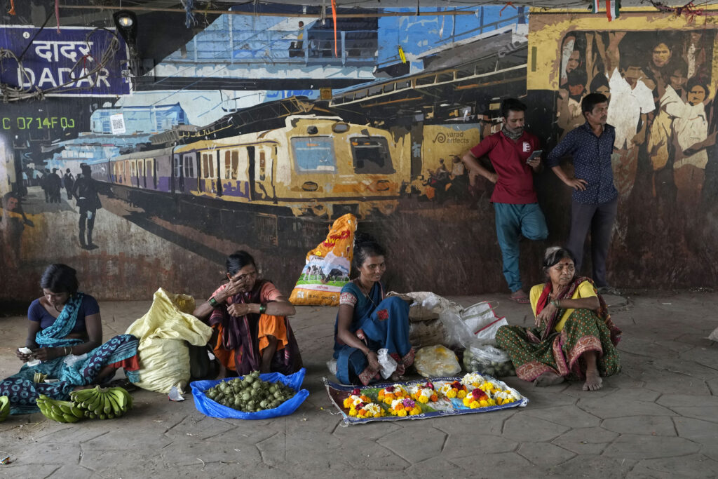 MUMBAI — An open market on Women’s Day: Indian women vendors await customers outside a train station on International Women’s Day in Mumbai, India, Friday, March 8, 2024.Photo: Rajanish Kakade/AP