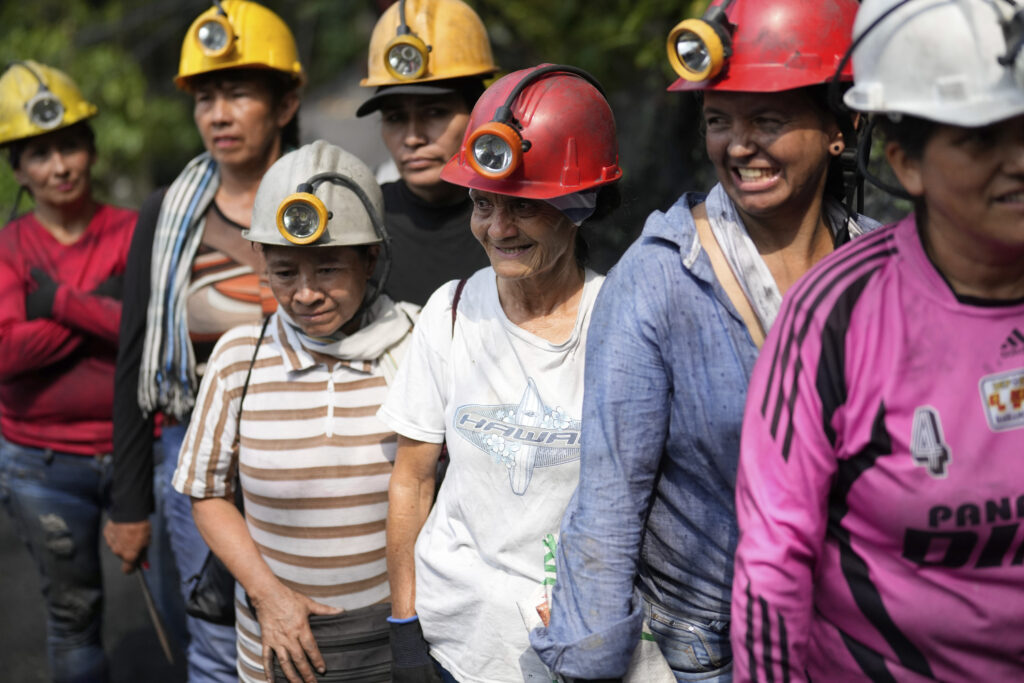 COLOMBIA — Are they smiling because it’s jewels? Emerald miners line up to enter the tunnels of an informal mine near the town of Coscuez, Colombia, Thursday, Feb. 29, 2024. After they enter in a single file, they branch off in different directions and head into tunnels where each person has a designated area to drill.Photo: Fernando Vergara/AP