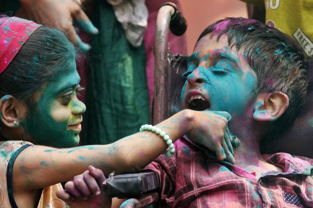INDIA — Always a big part of festivals, color brightens a child’s day: Special needs children participate in an early celebration of Holi, the Hindu festival of colors, at their school in Mumbai, India, Friday, March 22, 2024.Photo: Rajanish Kakade/AP