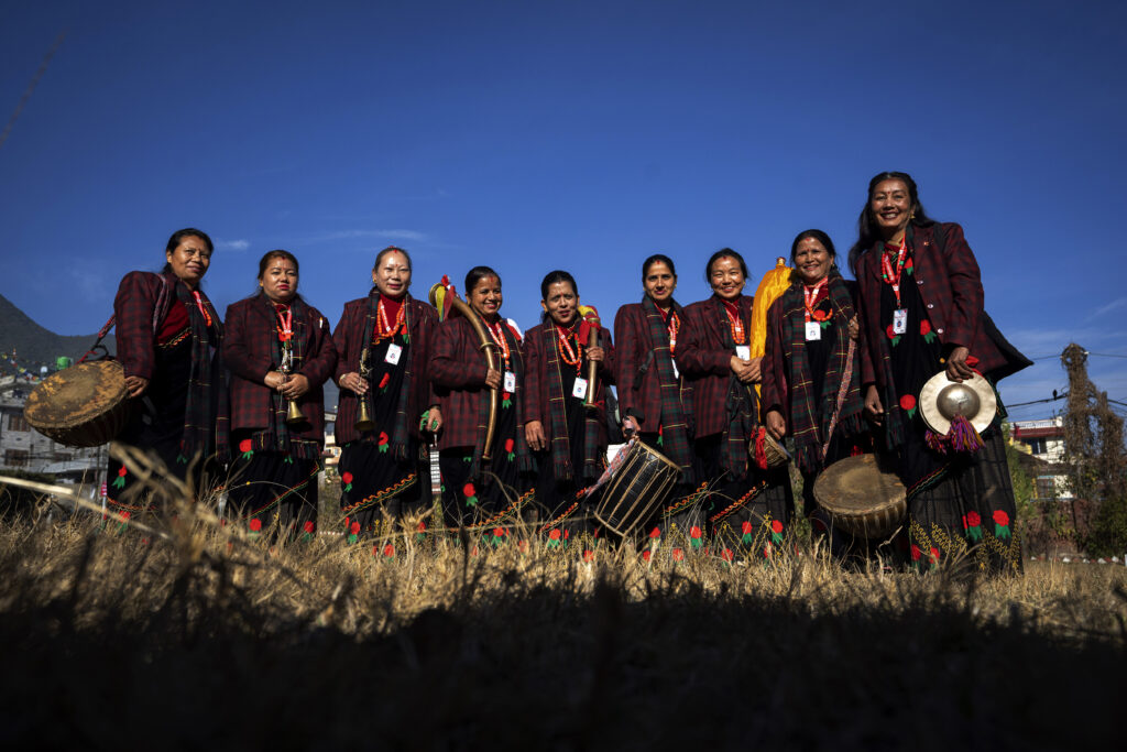 NEPAL — It’s a wedding band — not the kind you might think: Band members of Shrijanshil Mahila Sanstha, or the Self-Reliant Women’s Group, stand for a photograph before they prepare to play at a wedding in Kathmandu, Nepal, on Wednesday, March 6, 2024. Once associated only with men from the Damai community, part of the lowest caste, these nine women have come together to play the Naumati Baja, or nine traditional instruments. Discrimination based on caste is believed to have caused some Dalit musicians to quit playing Naumati Baja.Photo: Niranjan Shrestha/AP