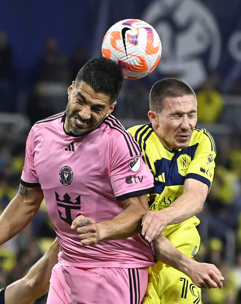 NASHVILLE — ‘Ouch! Was that me? — No, it was me, ouch!’: Inter Miami forward Luis Suarez, left, and Nashville SC midfielder Alex Muyl (19) go for the ball during the first half of a CONCACAF Champions Cup tournament soccer match Thursday, March 7, 2024, in Nashville, TN.Photo: Mark Zaleski/AP
