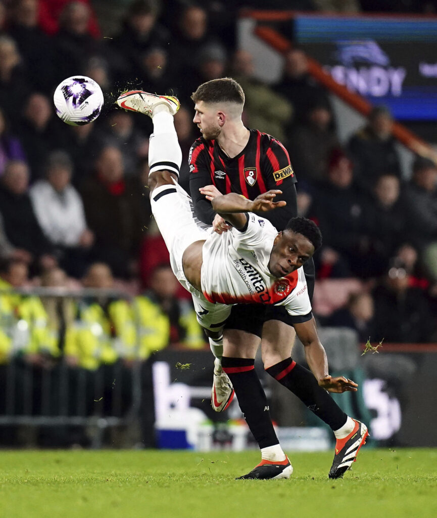 ENGLAND — Cartwheeling through the match: Bournemouth's Chris Mepham, background and Luton Town's Chiedozie Ogbene vie for the ball during the English Premier League soccer match between Bournemouth and Luton Town, at the Vitality Stadium, in Bournemouth, England, Wednesday, March 13, 2024.Photo: John Walton/PA via AP