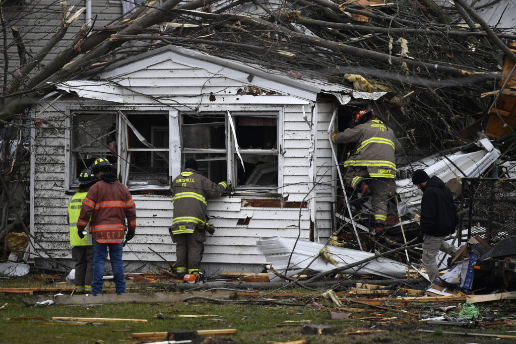 OHIO — Nature’s revenge — storm destruction reigns in all corners of the Earth today: Members of the Huntsville Volunteer Fire Department enter a home to search for victims following a severe storm in Lakeview, OH, Friday, March 15, 2024.Photo: Timothy D. Easley/AP