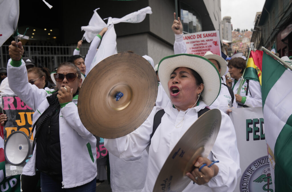 LA PAZ — Making noise for the right to work: Health workers protest against forced retirement in La Paz, Bolivia, Wednesday, March 6, 2024. The government of President Luis Arce is proposing a new pension bill to the Plurinational Legislative Assembly that includes forced retirement at age 65.Photo: Juan Karita/AP