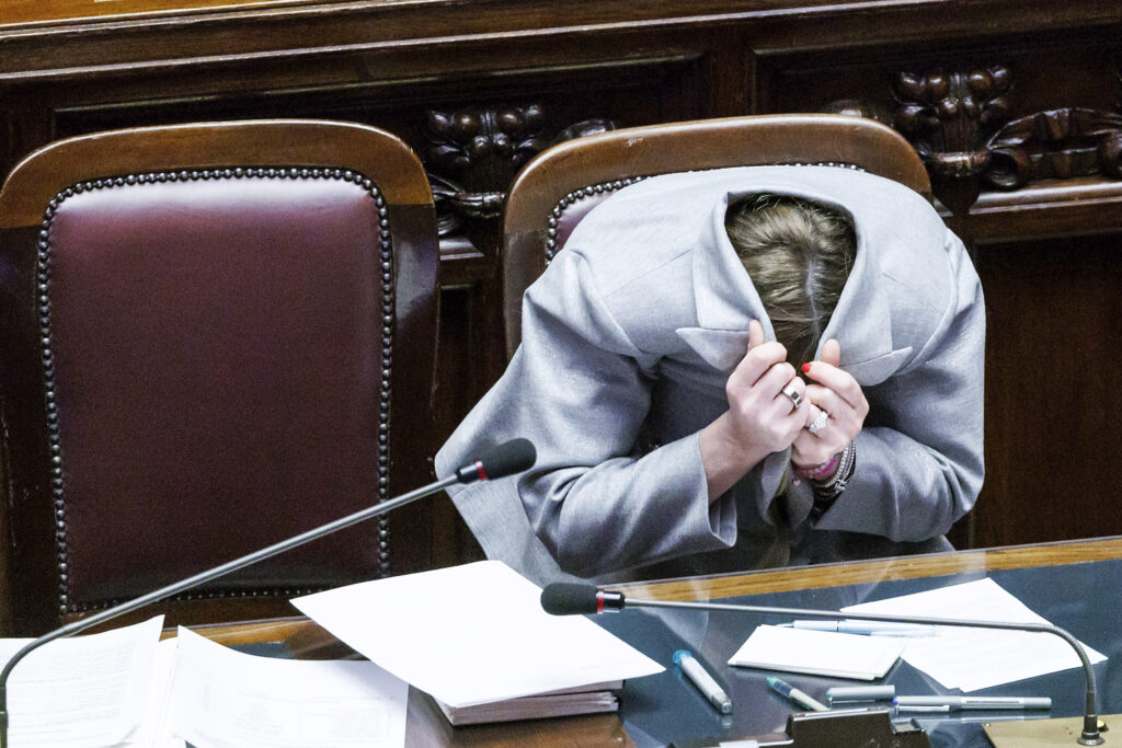 ROME — Classroom antics, now a common occurrence all over the world in governance chambers: Italian Premier Giorgia Meloni hides herself in her jacket after opposition lawmaker Angelo Bonelli told her not to look at him with a "disturbing look" during his intervention on the occasion of Meloni's briefing to the Lower Chamber of Deputies ahead of the EU Summit in Brussels, in Rome, Wednesday, March 20, 2024.Photo: Roberto Monaldo/LaPresse via AP