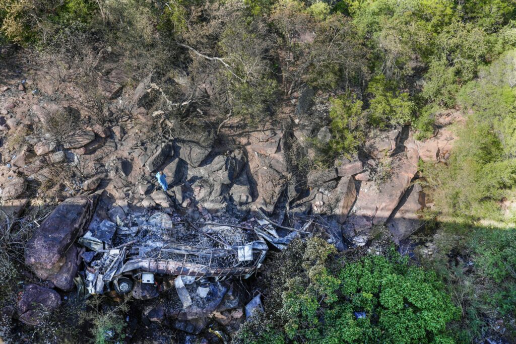 JOHANNESBURG — Brutal, fatal crash with bus load of worshippers: The wreckage of a bus lays in a ravine a day after it plunged off a bridge on the Mmamatlakala mountain pass between Mokopane and Marken, around 300km (190 miles) north of Johannesburg, South Africa, Friday, March 29, 2024. A bus carrying worshippers on a long-distance trip from Botswana to an Easter weekend church gathering in South Africa plunged off a bridge on a mountain pass Thursday and burst into flames as it hit the rocky ground below, killing at least 45 people, authorities said. The only survivor was an 8-year-old child who was receiving medical attention for serious injuries.Photo: Themba Hadebe/AP