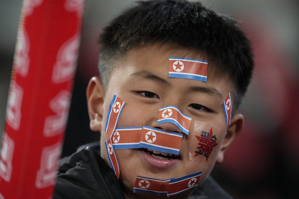 TOKYO — This is not about protests … it’s about the GOOOAAALLL: A fan has pasted North Korean flags on his face ahead of the FIFA World Cup 2026 and AFC Asian Cup 2027 preliminary joint qualification round two matches between Japan and North Korea at the National Stadium Thursday, March 21, 2024, in Tokyo.Photo: Eugene Hoshiko/AP