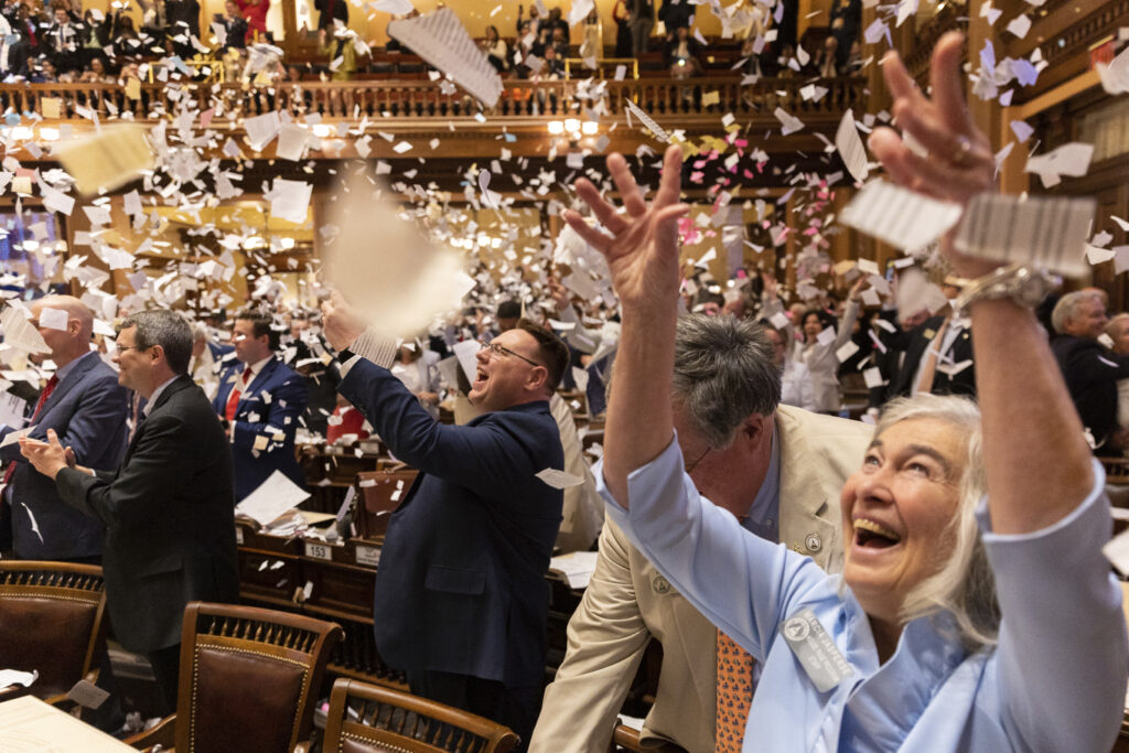 ATLANTA — Don’t worry, the data on all this paper is in our computers: State representatives throw paper in the air to celebrate the end of the legislative session at the House of Representatives in the Capitol in Atlanta on Sine Die, Thursday, March 28, 2024.Photo: Arvin Temkar/Atlanta Journal-Constitution via AP