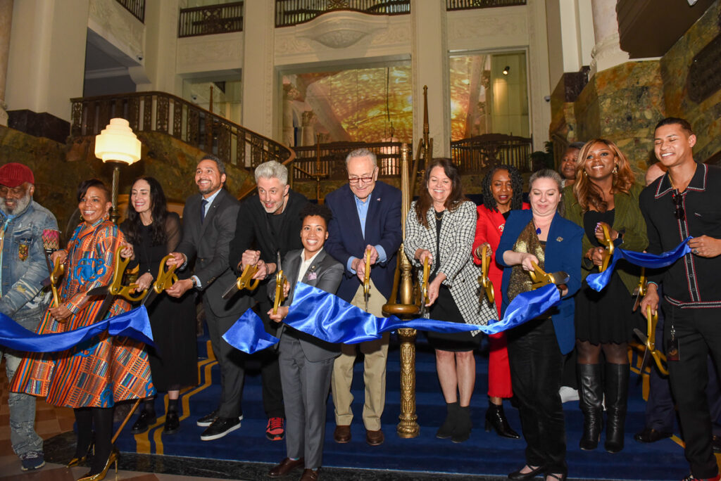 From Left to Right: Founder Def Poetry Danny Simmons Jr.; NYC Commissioner of Cultural Affairs. Laurie Cumbo; Sr. VP Booking, Live Nation, Stacie George; NYS Secretary of State Robert Rodriguez; President, Live Nation Venues, Tom See; Councilmember, Crystal Hudson; Sen. Chuck Schumer; President of Long Island University, Kimberly Cline; Congressmember Yvette Clark; Brooklyn Paramount General Manager, Margaret Holmes; Deputy Borough President Kim Council; and Councilmember Farah Louis cut the ribbon at the Brooklyn Paramount opening night on March 27, 2024.