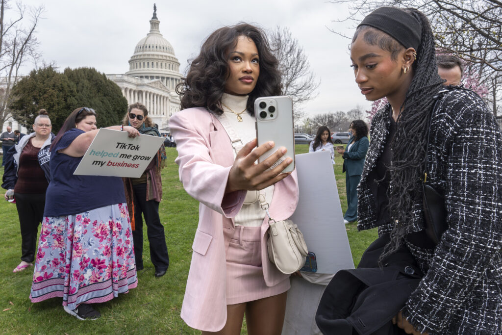 WASHINGTON, DC — Clock is ‘tick-tocking’ on the fate of fastest-growing, most threatening influencer: Devotees of TikTok, Mona Swain, center, and her sister, Rachel Swain, right, both of Atlanta, monitor voting at the Capitol in Washington, as the House passed a bill that would lead to a nationwide ban of the popular video app if its China-based owner doesn’t sell, Wednesday, March 13, 2024. Lawmakers contend the app’s owner, ByteDance, is beholden to the Chinese government, which could demand access to the data of TikTok’s consumers in the U.S.Photo: J. Scott Applewhite/AP