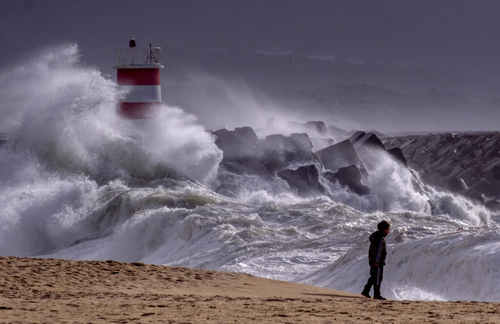 PORTUGAL — Where rocks and waves meet in big weather: Big waves approach the beach of Nazare, Portugal, Tuesday, March 26, 2024. The high waves were caused by strong winds at one of the world's most popular surf spots.Photo: Michael Probst/AP