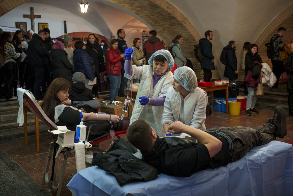 KYIV — Support at home for the war effort: People wait in line to donate blood for wounded Ukrainian personnel during an event in the basement of the St. Nicholas Roman Catholic Church, in Kyiv, Ukraine, Tuesday, March 19, 2024.Photo: Vadim Ghirda/AP