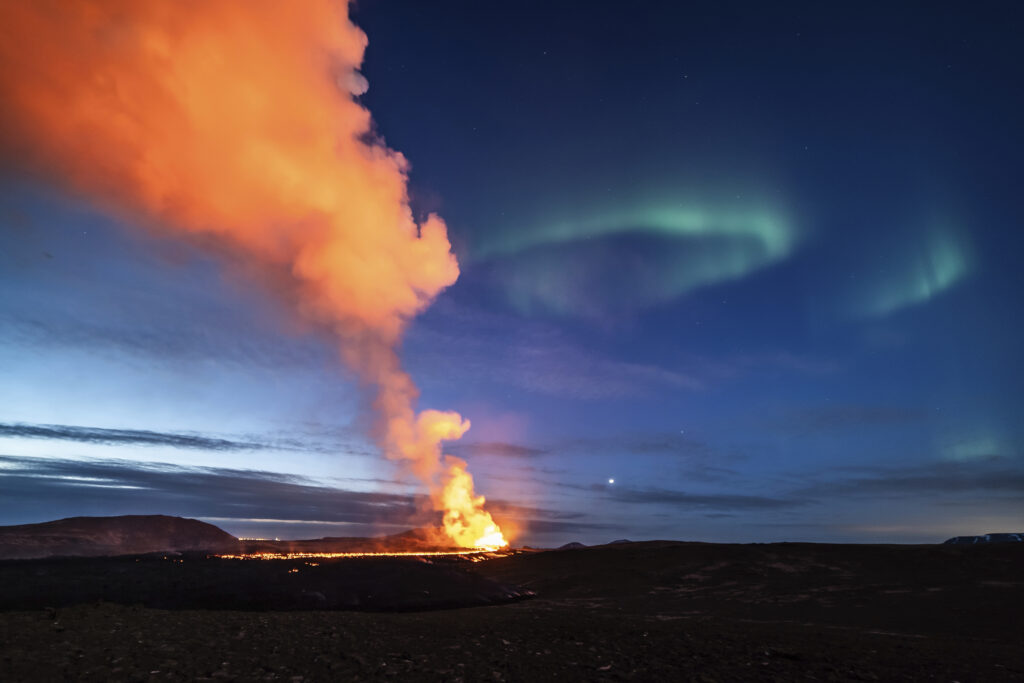 GRINDAVIK — Knock, knock, it’s nature calling, reminding us of the power of our core: A view of the lava flowing from the volcano backdropped by the Northern Lights, near the town of Grindavik, Iceland, early Monday, March 25, 2024.Photo: Marco di Marco/AP