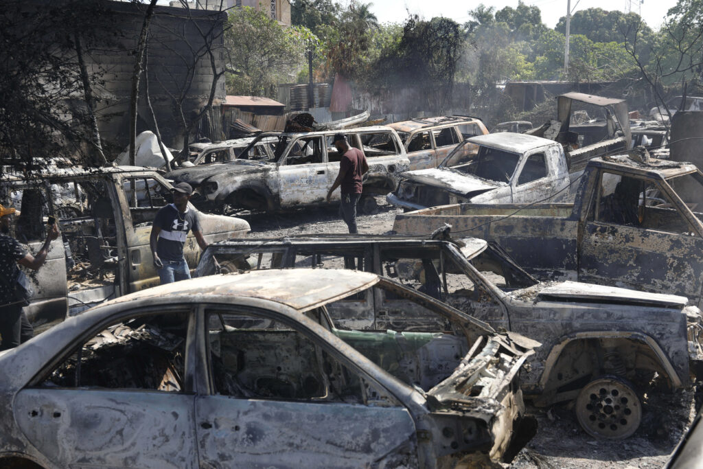 PORT-AU-PRINCE — Aftermath of gang violence, which is, let’s face it, an autocratic system: People look for salvageable pieces from burned cars at a mechanic shop that was set on fire during violence by armed gangs in Port-au-Prince, Haiti, Monday, March 25, 2024.Photo: Odelyn Joseph/AP