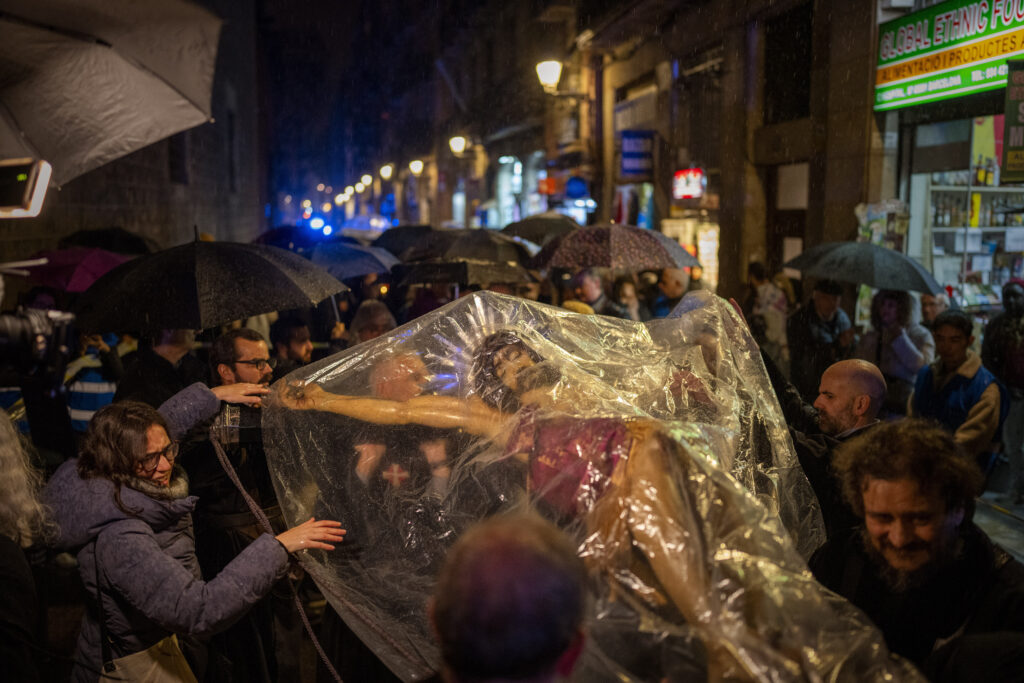 BARCELONA — Prayers for rain answered: Worshippers cover the image of the Holy Christ of the Blood with a plastic sheet while it rains during a procession asking for rain through the streets of downtown Barcelona, Spain, Saturday, March 9, 2024. Preceded by nine days of prayers and emulating a documented historical tradition dating back five hundred years, worshippers requested rain as Catalonia, last month, declared a drought emergency for the area of around 6 million people, including the city of Barcelona.Photo: Emilio Morenatti/AP