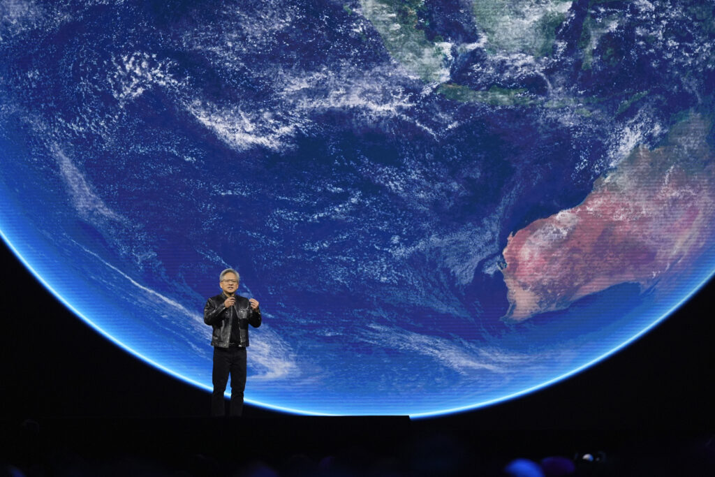 SAN JOSE — Dwarfed by a giant blue marble: CEO Jensen Huang speaks about AI and climate during the keynote address of Nvidia GTC in San Jose, CA, Monday, March 18, 2024.Photo: Eric Risberg/AP
