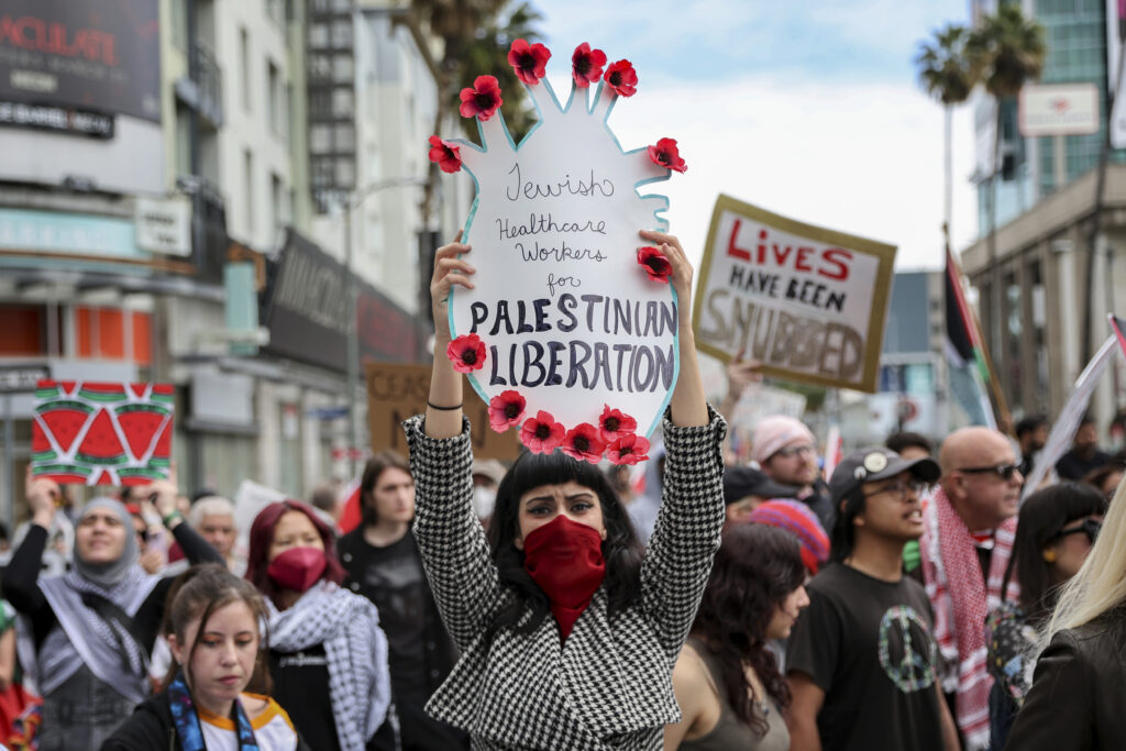 LOS ANGELES — If a movie about this war comes out, will that garner more attention? A protester holds a poster during a demonstration in support of Palestinians calling for a ceasefire in Gaza as the 96th Academy Awards Oscars ceremony is held nearby, Sunday, March 10, 2024, in the Hollywood section of Los Angeles.Photo: Etienne Laurent/AP