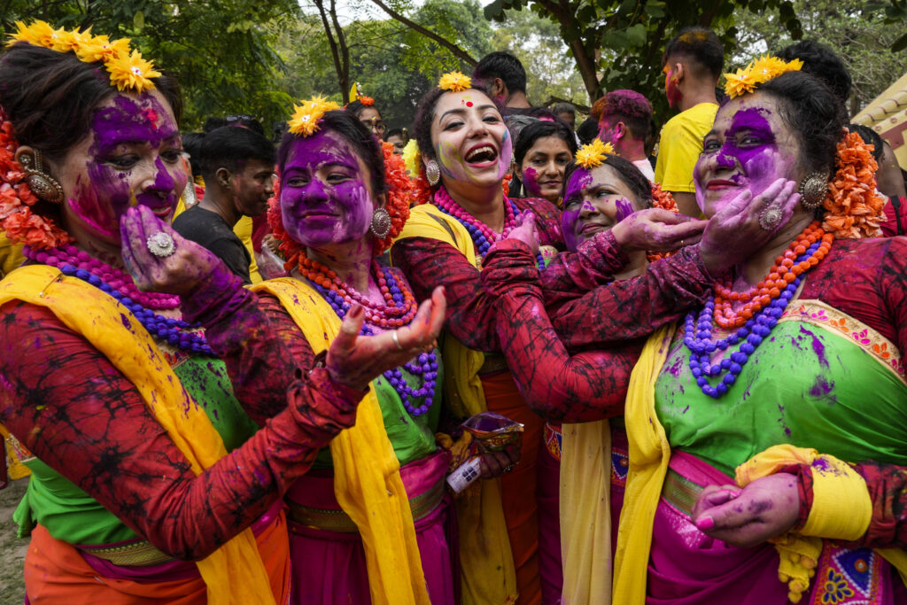 KOLKATA — Hindu festivals’ use of color carries over to fashion, even weddings: Women put colored powder on each other as they celebrate Holi, the festival of colors, in Kolkata, India, Monday, March 25, 2024. The festival heralds the arrival of spring.Photo: Bikas Das/AP