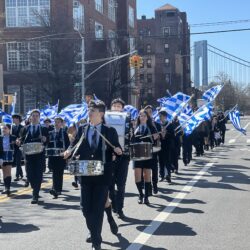 Student musicians marching through the streets at 203rd Greek Independence parade.