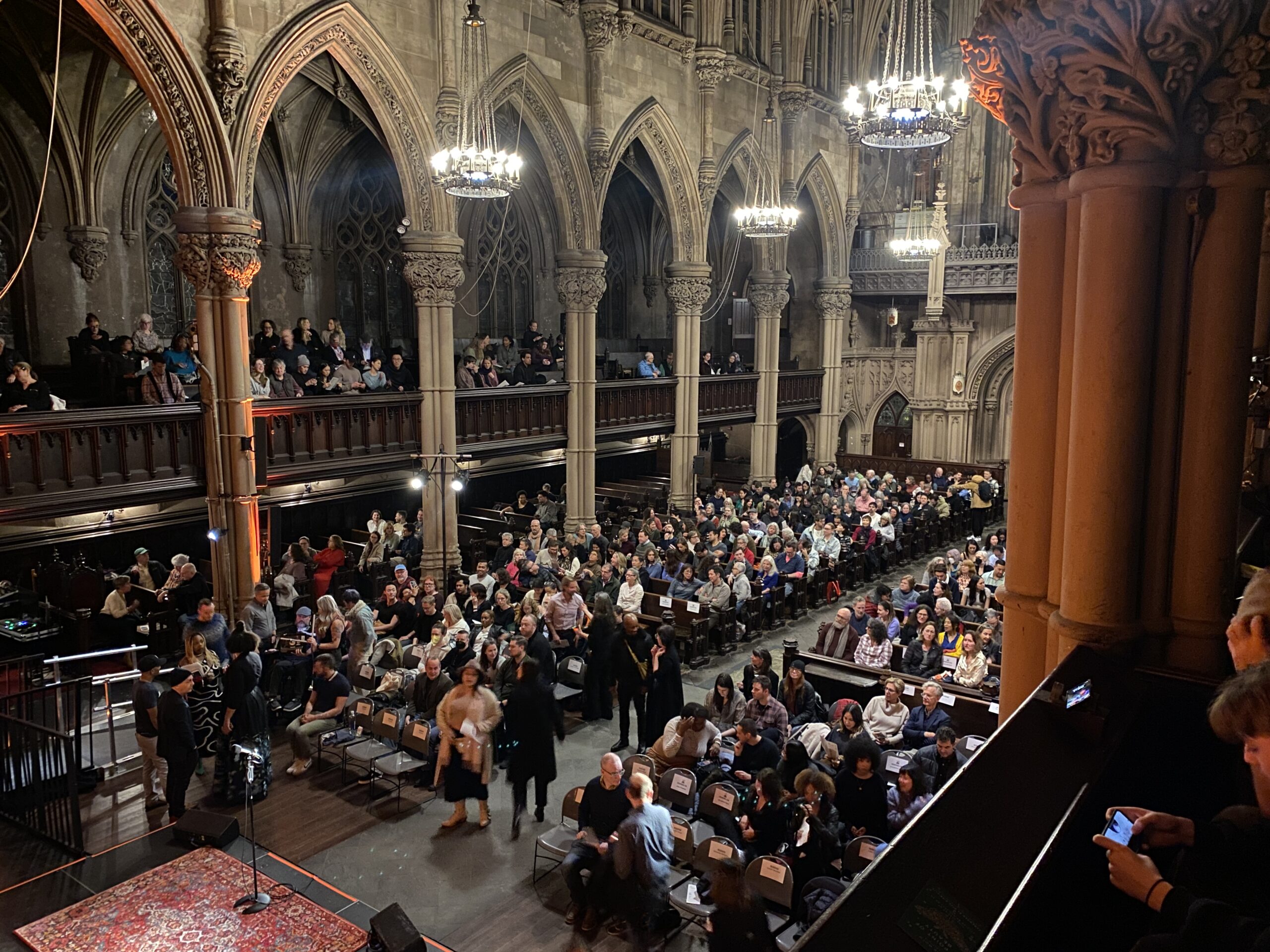 The stately landmarked interior of St. Ann & Holy Trinity Church, lined by famous William Bolton stained glass windows, was packed for impactful storytelling, hosted by The Moth.Photo: Brooklyn Eagle Staff