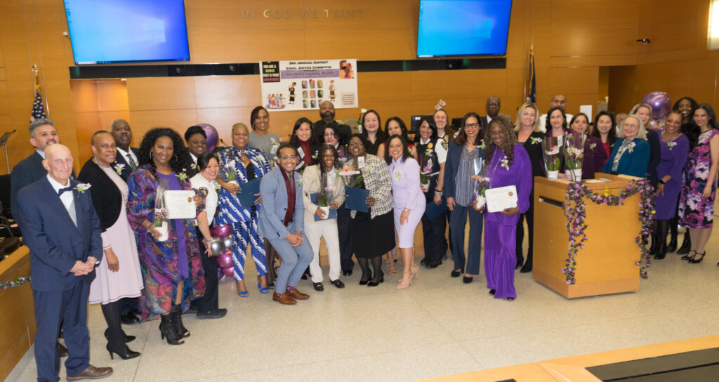 A collective photo featuring the Equal Justice Committee members alongside the honorees at SJDEJC Women's History Month.