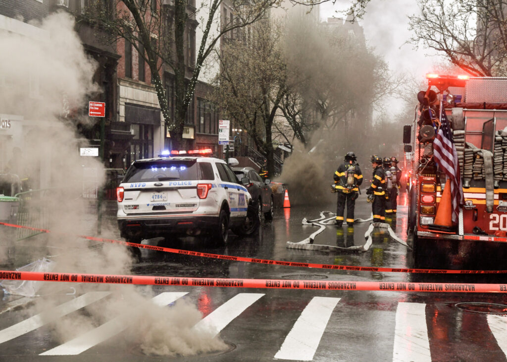 Firefighters respond as thick smoke poured out of two manholes on Montague Street in Brooklyn Heights shortly before 4 p.m. on Saturday afternoon.