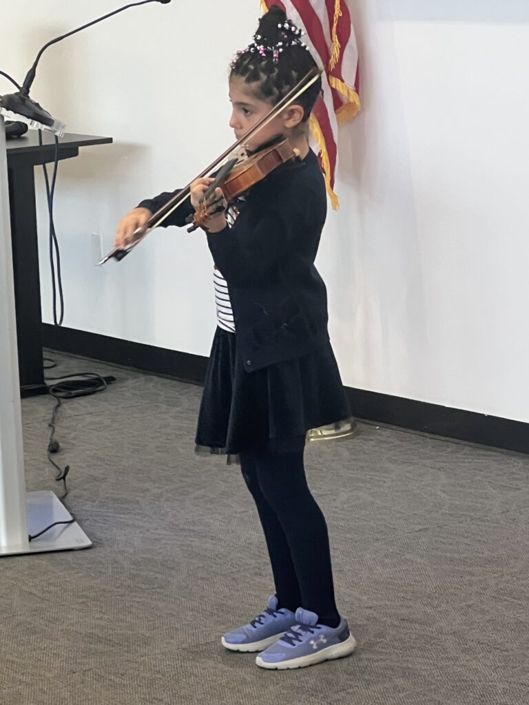 10-year-old violinist Lucia-Victoria Dadalyan-Sogomonyan also performed at Sunday’s event for Women of Distinction.