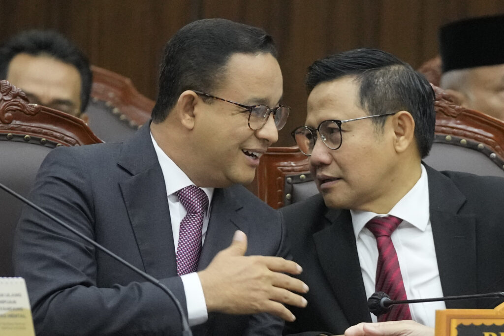 JAKARTA — All over the world, it’s politicians talking… well, politics: Losing presidential candidate Anies Baswedan, left, talks with his running mate Muhaimin Iskandar during the first hearing of his legal challenge to the Feb. 14 presidential election alleging widespread fraud, at the Constitutional Court in Jakarta, Indonesia, Wednesday, March 27, 2024. Defense Minister Prabowo Subianto, who chose the son of the popular outgoing President Joko Widodo as his running mate, won the election by 58.6% of the votes, according to final results released by the Election Commission.Photo: Dita Alangkara/AP