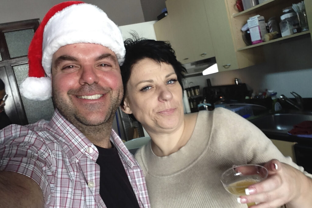 In this image provided by Johnathan Walton, Walton and Marianne "Mair" Smyth pose for a selfie in December 2013 at her tree-trimming Christmas party in downtown Los Angeles.Production: Javier Arciga/AP