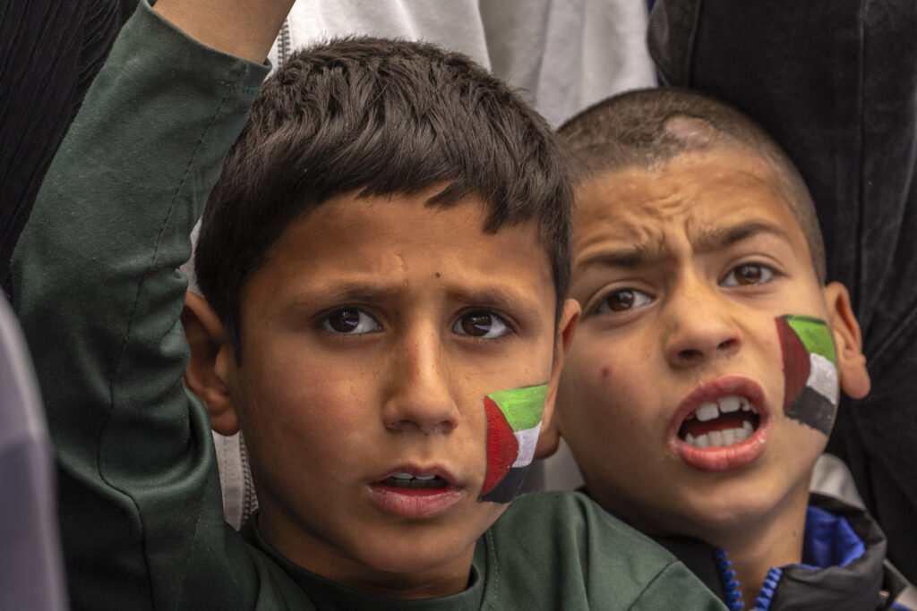 Kashmiri Shiite Muslim boys with Palestinian flag painted on their face shout slogans as they mark Quds Day, or Jerusalem Day, in support of Palestinians, on the outskirts of Srinagar, Indian controlled Kashmir, Friday, April 5, 2024. The name Quds Day comes after the Arabic name for Jerusalem. The last Friday of the Muslim holy fasting month of Ramadan, has been marked as Quds Day since the start of the 1979 Islamic Revolution led by the Iranian spiritual leader late Ayatollah Ruhollah Khomeini. (AP Photo/Dar Yasin)