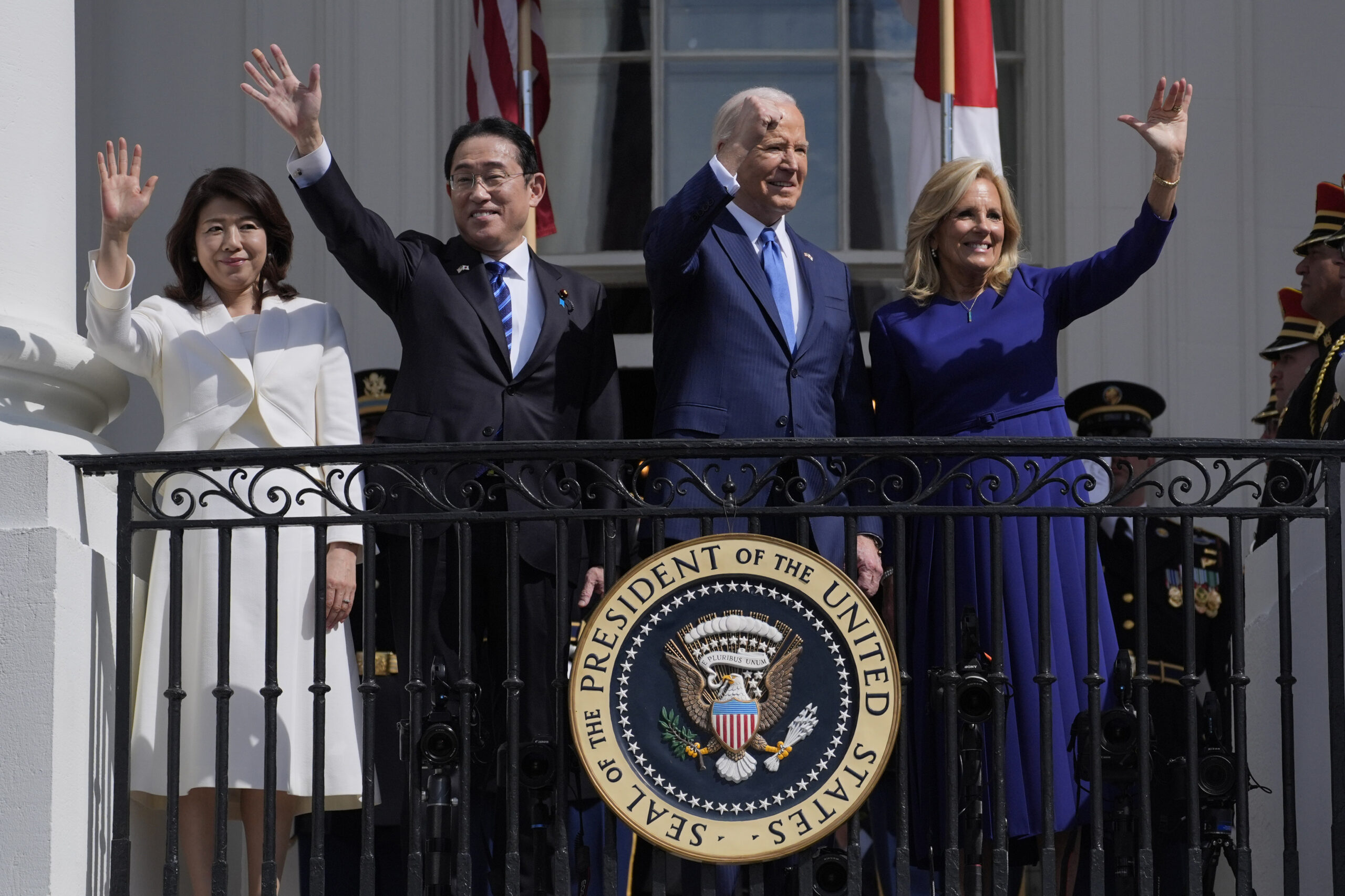 President Joe Biden and first lady Jill Biden wave from the Blue Room Balcony with Japanese Prime Minister Fumio Kishida and his wife Yuko Kishida during a State Arrival Ceremony on the South Lawn of the White House, Wednesday, April 10, 2024, in Washington. (AP Photo/Evan Vucci)