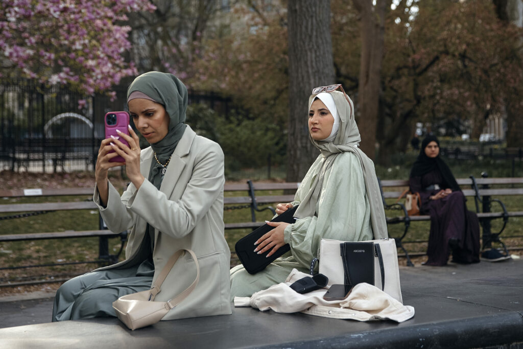 Muslims hang out during an Eid al-Fitr prayer, marking the end of the fasting month of Ramadan at Washington Square Park on Wednesday, April 10, 2024, in New York. (AP Photo/Andres Kudacki)